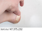 A patch on a man's leg. Protection against calluses on the foot. Стоковое фото, фотограф Александр Поташев / Фотобанк Лори