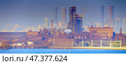 Manama, Bahrain- Jan 08 2024, Panoramic view of the industrial port buildings, constructions, the skyscrapers of Manama are visible in the distance, in the daytime, Manama, Bahrain. Редакционное фото, фотограф Сергей Богомяко / Фотобанк Лори