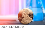 Moscow March 23 2025, Nobel Prize Concept. An image of Nobel Prize Stockholm Sweden. A golden image of the Nobel Prize decorates. Nobel Prize. The award of the year. Prize Alfred Nobel. humanity award. Редакционное фото, фотограф Скрипачев Антон / Фотобанк Лори