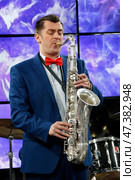 Belarus, Gomel, the performance of the Gomel city orchestra. March 29, 2017.Playing the saxophone.Profession musician. Saxophonist. Performing Jazz. Редакционное фото, фотограф Лазаренко Светлана / Фотобанк Лори