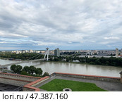 Panorama of Bratislava: SNP bridge, Danube River. View from castle to sights of capital of Slovakia. Редакционное фото, фотограф Алёна Остроухова / Фотобанк Лори