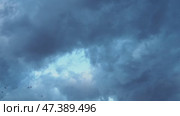 Heavy clouds fill the sky, signaling an impending storm. The atmospheric change creates a dramatic backdrop as daylight wanes, hinting at rain on the horizon. Time lapse. Стоковое видео, видеограф Юлия Петровская / Фотобанк Лори