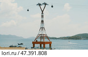 Cable car to Vinpearl amusement park in the morning sunshine to attract tourists to the weekend relaxing in Nha Trang, Vietnam. Стоковое фото, фотограф Mikhail Davidovich / Фотобанк Лори
