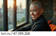 Warm Sunlight Bathes a Woman With a Shaved Head as She Smiles Contentedly by a Sunny Window in an Urban Setting. Стоковое AI-изображение, AI-художник Sergey Grishin / Фотобанк Лори