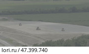 Summer, field, green vegetation, sand embankment, road equipment, road rollers compact the surface. Стоковое видео, видеограф Опока Алексей / Фотобанк Лори