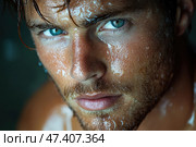 A close-up of a man's face with expressive light blue eyes and wet skin covered in beads of water and sweat. His gaze is intense and piercing, and the lighting emphasizes the texture of his skin and the wetness, giving the photograph a sense of strength, energy, and drama. The man has short stubble, slightly disheveled hair, and a tanned skin tone. The background is darkened, the focus is entirely on the face and emotions. Стоковое AI-изображение, AI-художник Анна Кривицкая / Фотобанк Лори