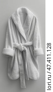 White hotel fleece bathrobe on a white background. Белый гостиничный флисовый халат на белом фоне. Стоковое AI-изображение, AI-художник Katsiaryna Repich / Фотобанк Лори