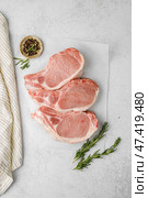 raw pork pieces on a light background. Стоковое фото, фотограф Julia Lavleis / Фотобанк Лори