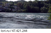 Река Рейн в городе Шаффхаузен. Швейцария. Май. The Rhine River in the city of Schaffhausen. Switzerland. May. Стоковое видео, видеограф Горшков Александр / Фотобанк Лори