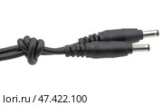 Кабель электропитания с фильтром на белом фоне. Male jack and ferrite bead inductor of power plug adapter on white backgroundd. Стоковое фото, фотограф Татьяна Д / Фотобанк Лори