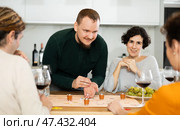 Group of friends is playing board game. Стоковое фото, фотограф Яков Филимонов / Фотобанк Лори