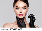 Professional aesthetic treatment on young woman's face in clinic setting. Профессиональная эстетическая процедура на лице молодой женщины в клинике. Стоковое AI-изображение, AI-художник Katsiaryna Repich / Фотобанк Лори
