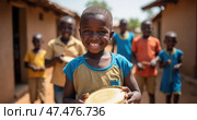Child Smiles With a Handmade Drum in a Vibrant African Village, Surrounded by Friends, Capturing Joy and Community Spirit. Стоковое AI-изображение, AI-художник Sergey Grishin / Фотобанк Лори