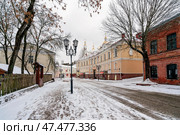 Vitebsk, Belarus, 01.06.2022: View of the tourist street in the historical center of the city  Tolstoy Street on a winter day. Редакционное фото, фотограф Ula Ulachka / Фотобанк Лори