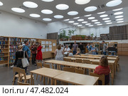 Visitors are in Vyborg Library, built from 1927 to 1935 (2023 год). Редакционное фото, фотограф EugeneSergeev / Фотобанк Лори
