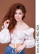 Studio portrait of a red-haired girl. Стоковое фото, фотограф Андрей Аркуша / Фотобанк Лори