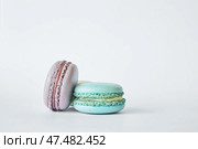 Stack of two colorful French Macarons, macaroons cakes with different flavors. Стоковое фото, фотограф Екатерина Якименко / Фотобанк Лори