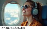 Exciting Travel Moments as a Young Woman Enjoys Her Flight, Experiencing the Joy of Music and Adventure From Above the Clouds. Стоковое AI-изображение, AI-художник Sergey Grishin / Фотобанк Лори