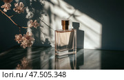 Elegant glass bottle of perfume on a marble surface with delicate flower petals and shadows during soft afternoon light. Стоковое AI-изображение, AI-художник Сергей Толмачёв / Фотобанк Лори