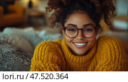 Portrait of a Cheerful Young Woman with Glasses in a Yellow Sweater, conveying warmth and approachability. Стоковое AI-изображение, AI-художник Данила Большаков / Фотобанк Лори