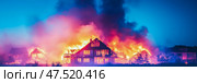 Inferno: Residential area engulfed by raging flames at night, showcasing devastation and the destructive power of uncontrolled fire. Стоковое AI-изображение, AI-художник Данила Большаков / Фотобанк Лори