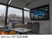 Интерьер салона с картой маршрута на экране. Электросудно плывёт от Южного речного вокзала в сторону причала «Нагатинский затон» на Москве-реке. Маршрут ЗИЛ — Печатники. Город Москва. Редакционное фото, фотограф Румянцева Наталия / Фотобанк Лори
