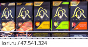 L'OR Capcule Coffee sale on the shelf in a super store. Редакционное фото, фотограф FotograFF / Фотобанк Лори