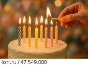 Brightly Lit Birthday Cake With Colorful Candles Being Ignited During a Celebration. Стоковое AI-изображение, AI-художник Юлия Гапеенко / Фотобанк Лори