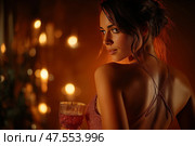 Elegant woman holding a drink in a dimly lit atmosphere at a party. Женщина уверенно стоит с бокалом в руке, освещенная мягким светом в уютной обстановке. Стоковое AI-изображение, AI-художник Katsiaryna Repich / Фотобанк Лори