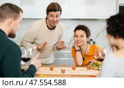 Group of friends is playing board game. Стоковое фото, фотограф Яков Филимонов / Фотобанк Лори