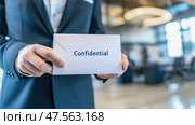 Businessman holding confidential envelope in office setting. Стоковое AI-изображение, AI-художник Юрий Поздников / Фотобанк Лори
