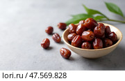 Sweet Arabian Dates in a Bowl Symbolize Traditional yet Vibrant Iftar Meal During Ramadan Fasting Period. Стоковое AI-изображение, AI-художник Sergey Grishin / Фотобанк Лори