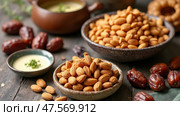 Experience a Sumptuous Spread of Traditional Arabic Food With Dates and Almonds During Ramadan Celebrations in a Festive Setting. Стоковое AI-изображение, AI-художник Sergey Grishin / Фотобанк Лори