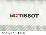 Moscow, Russia - 08.26.2024: Tissot store logo sign on a wall. Tissot is a Swiss watchmaker and the company was founded in Le Locle, Switzerland. Редакционное фото, фотограф Ирина Михайличенко / Фотобанк Лори
