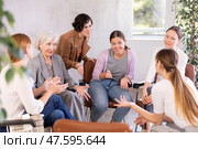 Female students discussing with groupmates sitting in circle in auditorium during classes room. Стоковое фото, фотограф Яков Филимонов / Фотобанк Лори