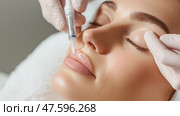 Expert administering lip filler procedure to enhance fullness in a serene clinic environment. Стоковое AI-изображение, AI-художник Сергей Толмачёв / Фотобанк Лори