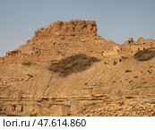 Ancient stone houses and on the mountain slopes in Guermassa region. South Tunisia. Tatouine governorate,Tunisia. Стоковое фото, фотограф Яков Филимонов / Фотобанк Лори