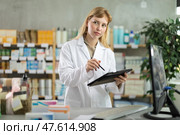 Female pharmacist working on tablet in pharmacy. Стоковое фото, фотограф Яков Филимонов / Фотобанк Лори