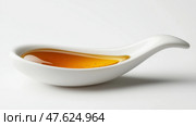 Artfully arranged dish showcasing golden honey in unique porcelain serving spoon. Искусно оформленное блюдо с золотистым медом в уникальной фарфоровой сервировочной ложке. Стоковое AI-изображение, AI-художник Katsiaryna Repich / Фотобанк Лори