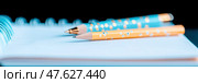 Creative school time: A bright notebook with blank page, a pen and a colorful pencil in a low angle close up for journaling, drawing, or writing. Стоковое AI-изображение, AI-художник Данила Большаков / Фотобанк Лори