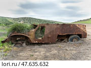 Abandoned Rusty Burnt Armored Vehicle in Countryside with Bullet Holes. Стоковое фото, фотограф Георгий Дзюра / Фотобанк Лори