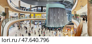 UAE, Dubai, 10 December 2024: the interiors of the largest shopping mall in the world, Dubai Mall, the storefronts of branded stores and visitors to the famous mall. Редакционное фото, фотограф Vladimir Drozdin / Фотобанк Лори
