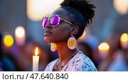 Remembrance Day: Woman at Candlelight Vigil, a Serene Tribute to Peace and Hope with Purple Sunglasses. Стоковое AI-изображение, AI-художник Данила Большаков / Фотобанк Лори