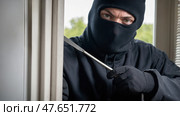 Candid burglary attempt with crowbar. Стоковое AI-изображение, AI-художник Андрей Бакусов / Фотобанк Лори