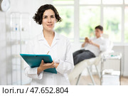 female doctor with folder. Стоковое фото, фотограф Яков Филимонов / Фотобанк Лори