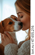 Woman Cuddles Her Dog in a Cozy Indoor Setting During a Sunny Afternoon. Стоковое AI-изображение, AI-художник Юлия Гапеенко / Фотобанк Лори