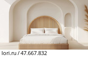 Minimalist bed with white cotton bedding and a woven rattan headboard. Минималистская кровать с белым хлопковым постельным бельем и плетеным ротанговым изголовьем. Стоковое AI-изображение, AI-художник Katsiaryna Repich / Фотобанк Лори