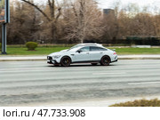 Mercedes GT 63 S AMG V8 BiTurbo car in motion. Mercedes AMG at high speed with blurred urban background. Редакционное фото, фотограф Константин Григорьев / Фотобанк Лори