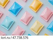 Colorful square packets arranged on a gradient background with soft lighting. Разноцветные квадратные пакеты на градиентном фоне с мягким освещением. Стоковое AI-изображение, AI-художник Katsiaryna Repich / Фотобанк Лори
