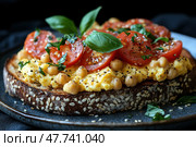 Delicious and nutritious breakfast - close-up of a sesame seed toast topped with a light fried egg, chickpeas, juicy cherry tomato slices and fresh basil leaves. The dish is garnished with freshly ground pepper and sesame seeds, served on a ceramic plate with a dark background that highlights the bright colors of the ingredients. A perfect shot for healthy eating ads, restaurant menus, food blogs, articles about diets and vegetarian lifestyle. Стоковое AI-изображение, AI-художник Анна Кривицкая / Фотобанк Лори